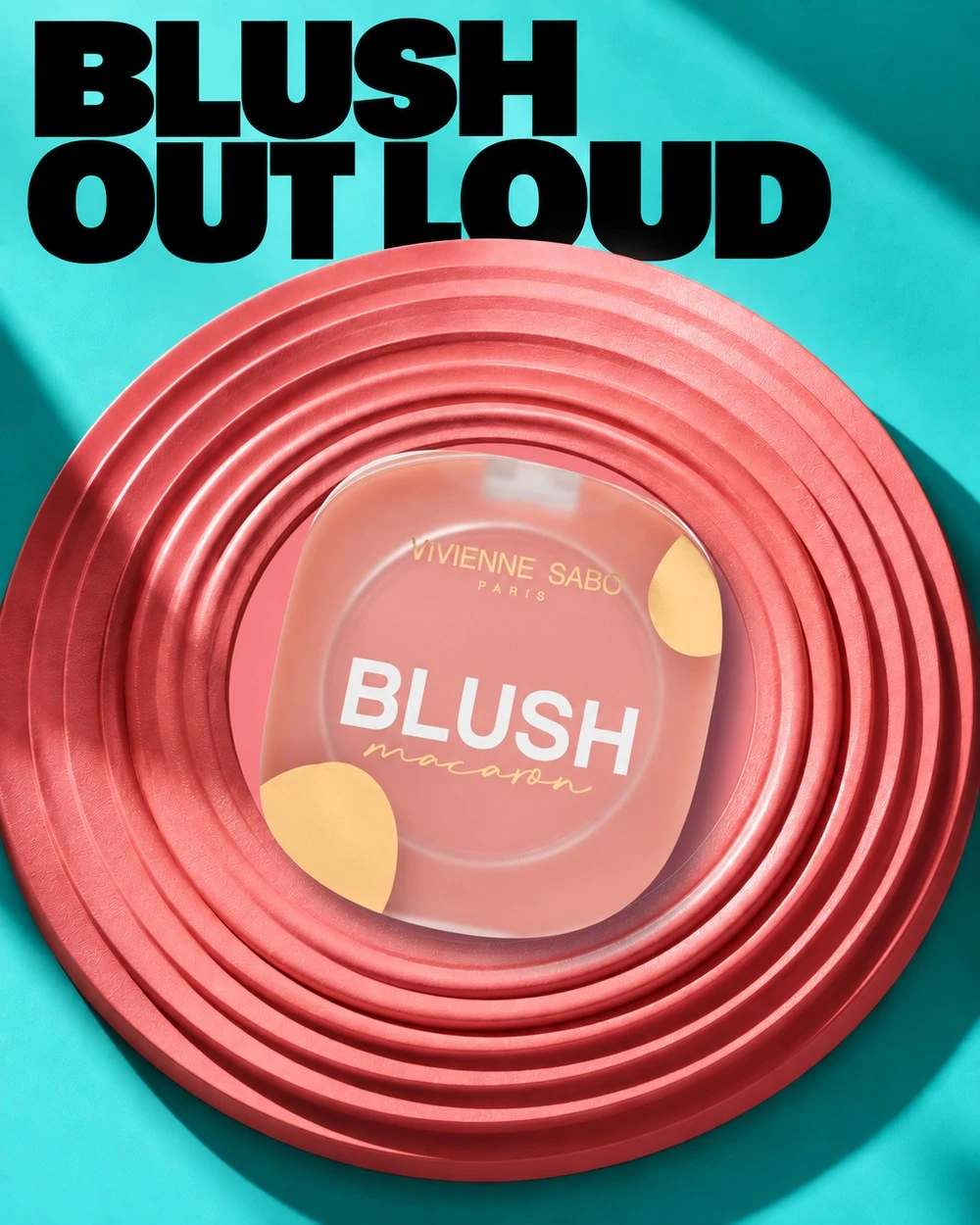 Blush ad on turquoise: compact on a stack of coral rings, headline Blush out loud
